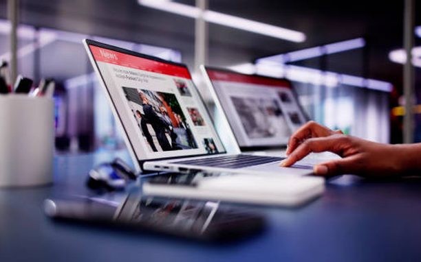 Online news publication open on a laptop